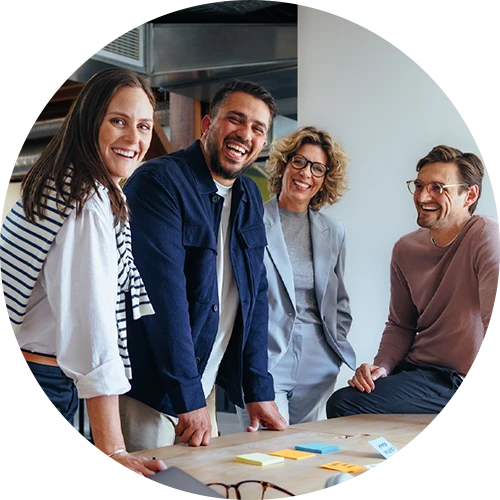 Happy people in an office smiling